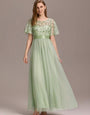 Evening Party wear Gown with Flutter Sleeves – Floor-Length Dress in Pista color for Wedding and Occasions dress .