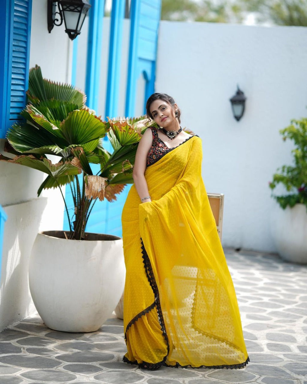 RADIANT YELLOW FAUX GEORGETTE SAREE WITH BUTTI WORK AND LACE BORDER