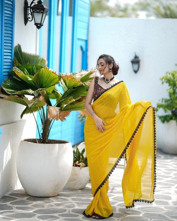 RADIANT YELLOW FAUX GEORGETTE SAREE WITH BUTTI WORK AND LACE BORDER